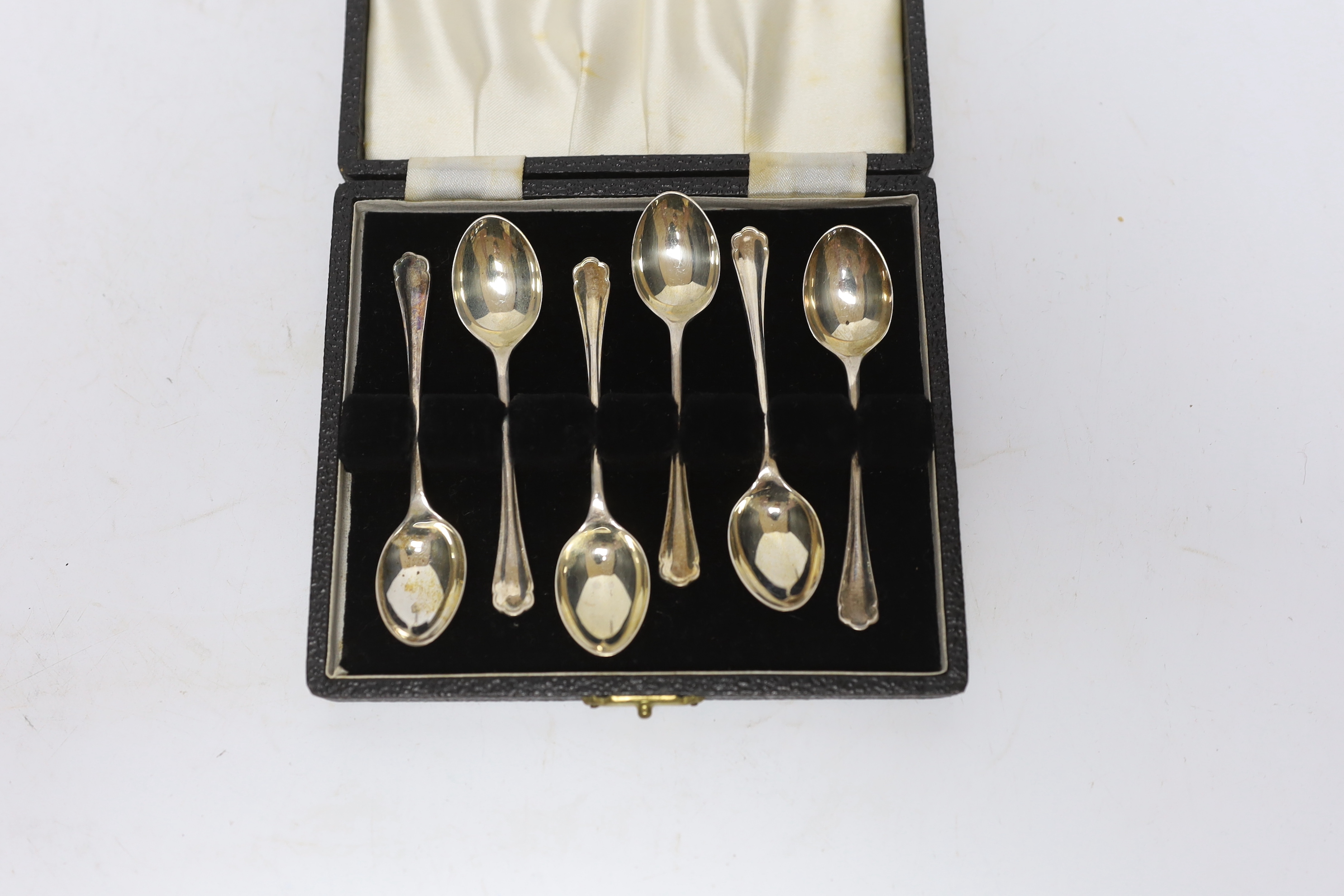 A modern silver wine funnel, Broadway & Co, London, 2003, 13.1cm and a cased set of six earlier silver coffee spoons.